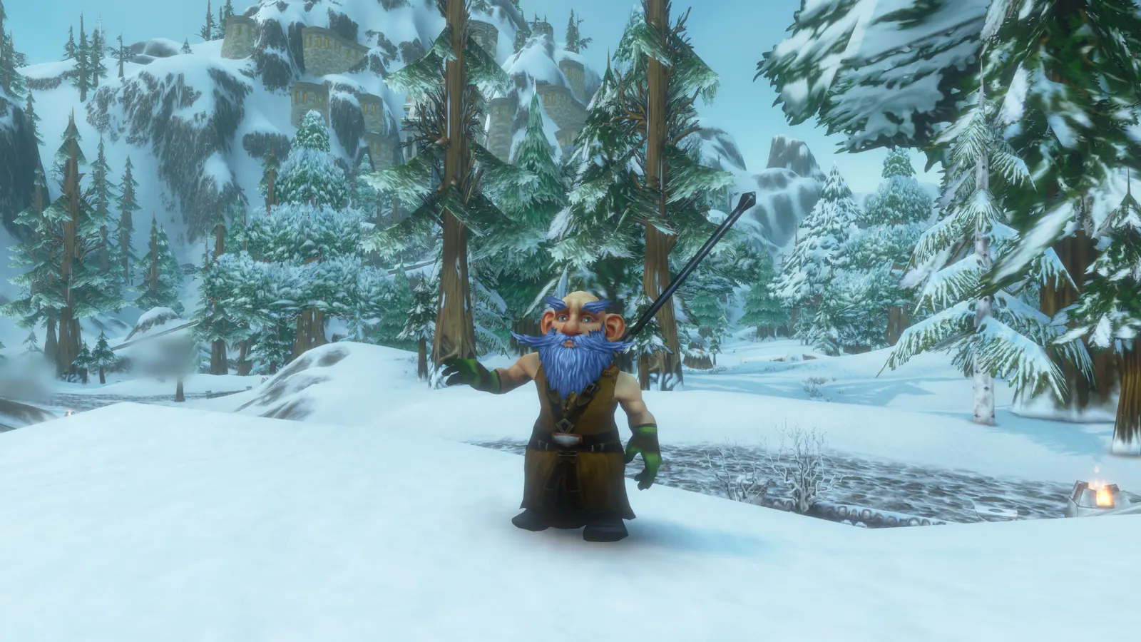 Nux Flux in a snowy forest clearing, reaching out an arm, staff on his back