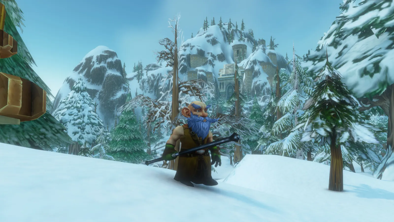 Nux Flux holding his staff on a snowy slope, pine trees and mountains behind him