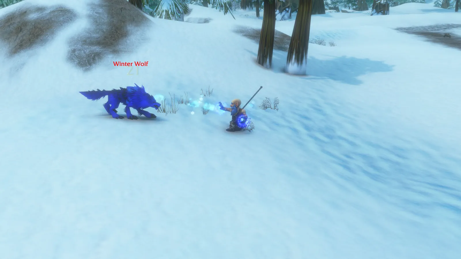 Nux Flux blasting frost at a snarling blue Winter Wolf on a snowy hillside